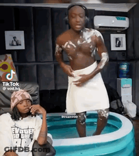Man With Towel Standing In Pool GIF