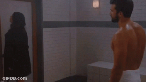 Man With Towel Standing Next To Woman GIF