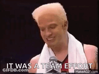 Man With Towel Talking Into Microphone GIF