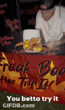 Man With Tray And Freak Boo Better Try It Sign GIF