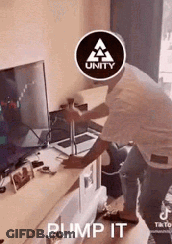 Man With Unity Logo In Front Of Television GIF