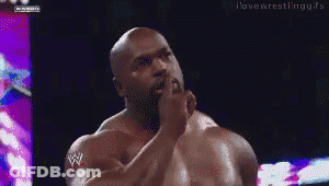 Man With W Logo On Arm In Dark Room GIF