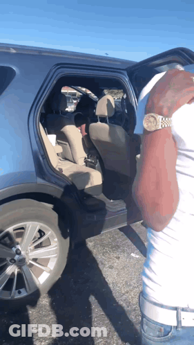 Man With Watch And Car With Open Door GIF