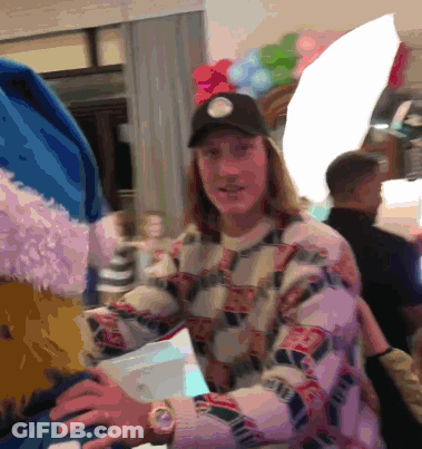 Man With Watch And Hat In Balloon Room GIF