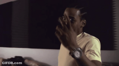 Man With Watch Covering Face GIF