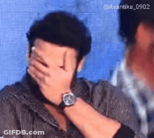 Man With Watch Covering Face GIF