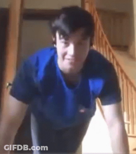 Man With Watch Holding Gun GIF