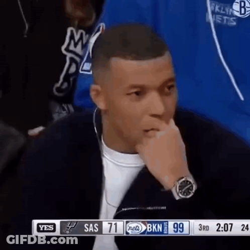 Man With Watch Sitting In Front Of TV GIF