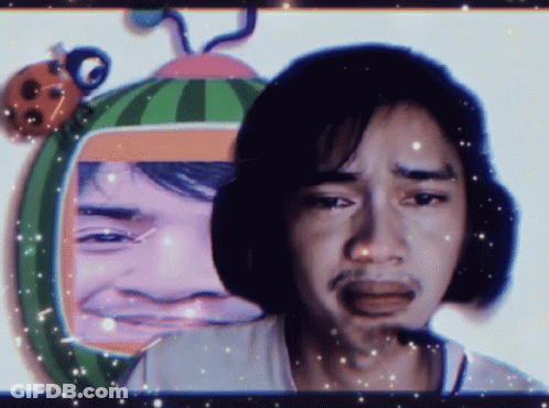 Man With Watermelon On Head Looks Sad GIF