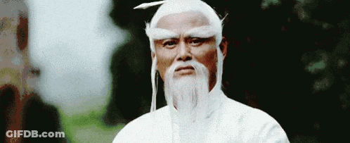 Man With White Beard, Wig, And Hat GIF