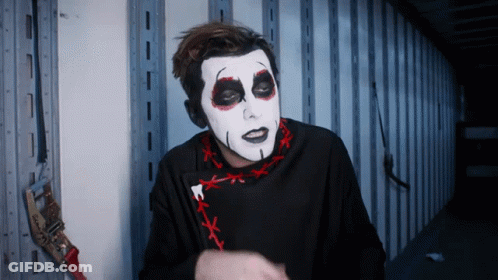 Man With White Face Paint And Black Shirt GIF