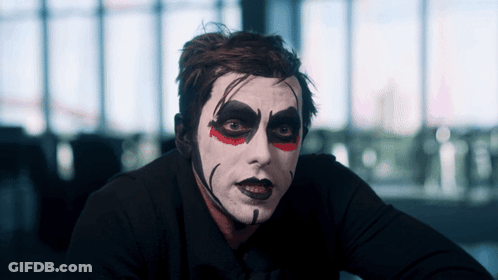 Man With White Face Paint And Red Eyes GIF