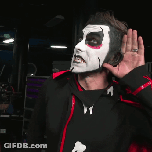 Man With White Face Paint In Black And Red Jacket GIF