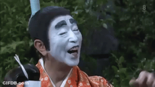 Man With White Face Paint In Kimono GIF