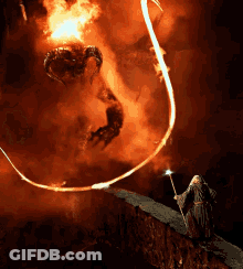 Man With White Hair And Beard Standing Before Crowd GIF