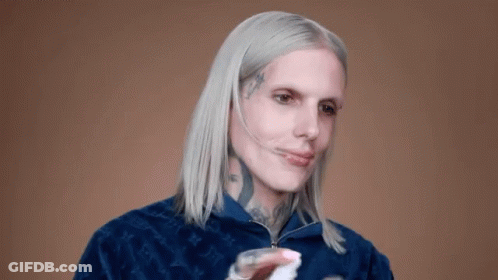 Man With White Hair And Face Tattoo In Blue Jacket GIF