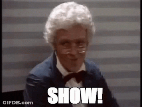 Man With White Hair And Glasses In Suit And Bow Tie Saying Show GIF