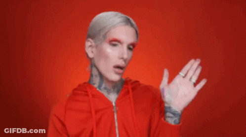 Man With White Hair And Tattoos In Red Hoodie GIF
