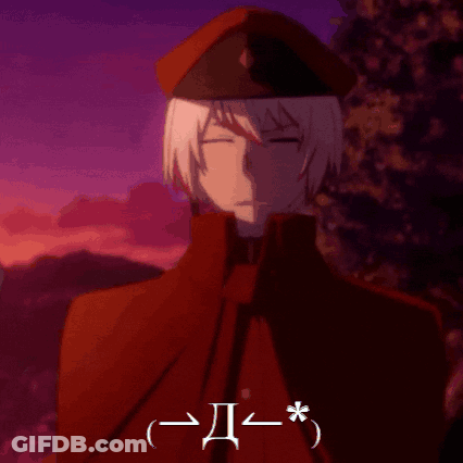 Man With White Hair In Red Cape And Red Hat With Letter I GIF