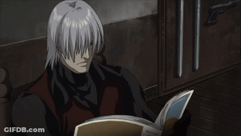 Man With White Hair Reading Foreign Language Book GIF
