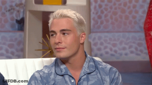 Man With White Hair Sitting On Couch GIF