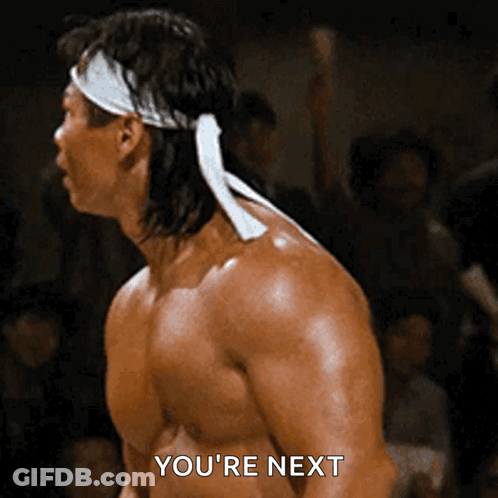 Man With White Headband Says Youre Next GIF