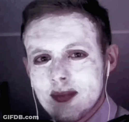 Man With White Mask Wearing Earbuds GIF