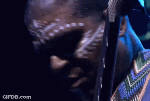 Man With White Paint On Face Looking Down GIF