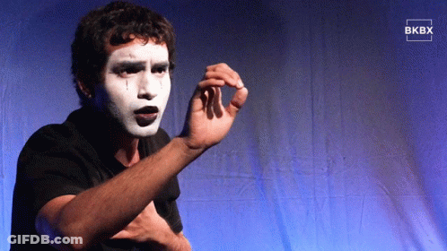 Man With White Paint On Face Standing Before Blue Curtain Saying BKBY GIF