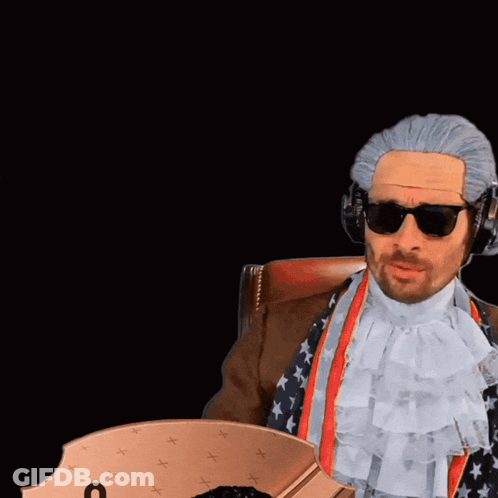 Man With Wig And Sunglasses Next To Man In Manchester United Shirt GIF