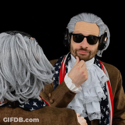 Man With Wig And Sunglasses Watches Man With Headphones GIF
