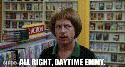 Man With Wig In Front Of Action Sign GIF