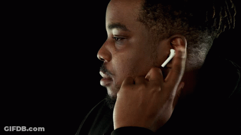 Man With Wireless Earbuds Finger In Ear GIF