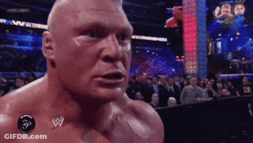 Man With Wrestling Logo On Chest GIF