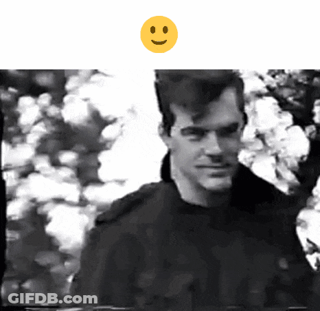Man With Yellow Smiley Face Above GIF