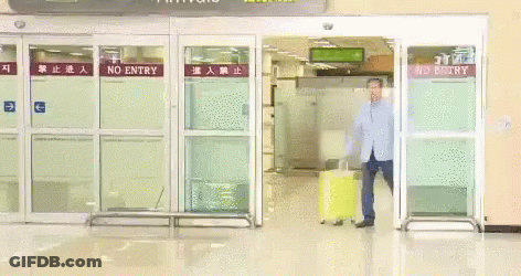 Man With Yellow Suitcase At No Entry Gate GIF