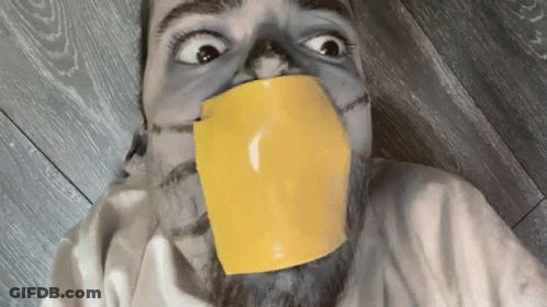 Man With Yellow Tape Around Mouth GIF