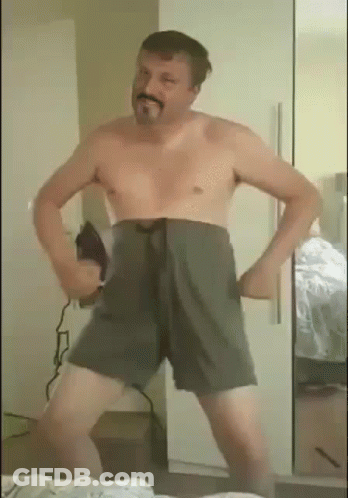 Man Without Shirt Dancing In Front Of Mirror GIF