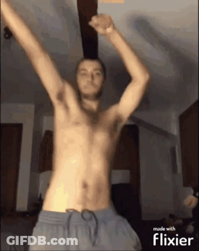 Man Without Shirt Dancing Under Ceiling Fan GIF