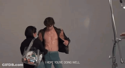 Man Without Shirt Held By Woman Saying I Hope You're Doing Well GIF