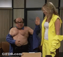 Man Without Shirt Helped By Woman In Yellow Suit GIF