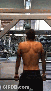 Man Without Shirt Holding Barbell In Gym GIF