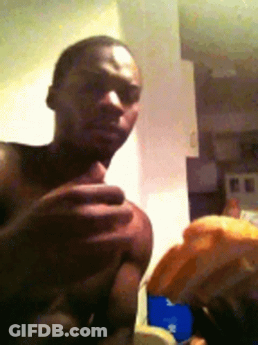 Man Without Shirt Holding Something In Kitchen GIF