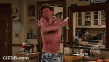 Man Without Shirt Holding Wine GIF