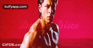 Man Without Shirt In Front Of Red Background Kulfyapp.com GIF