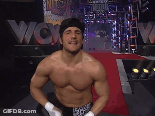 Man Without Shirt In Front Of WCW Sign GIF