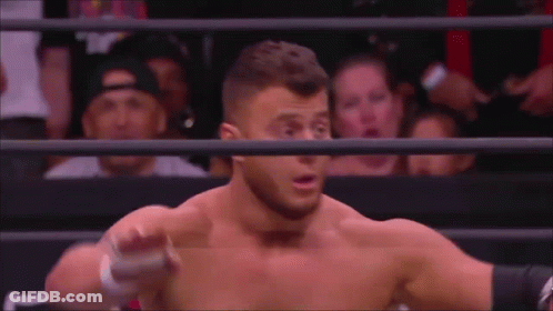 Man Without Shirt In Wrestling Ring With Crowd GIF