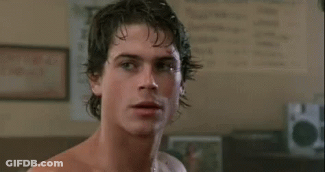Man Without Shirt Looking At Another Man GIF