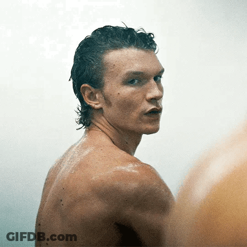 Man Without Shirt Looking At Camera GIF
