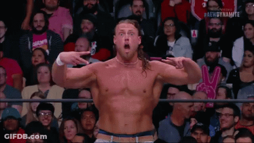 Man Without Shirt Pointing At Camera In Crowd GIF